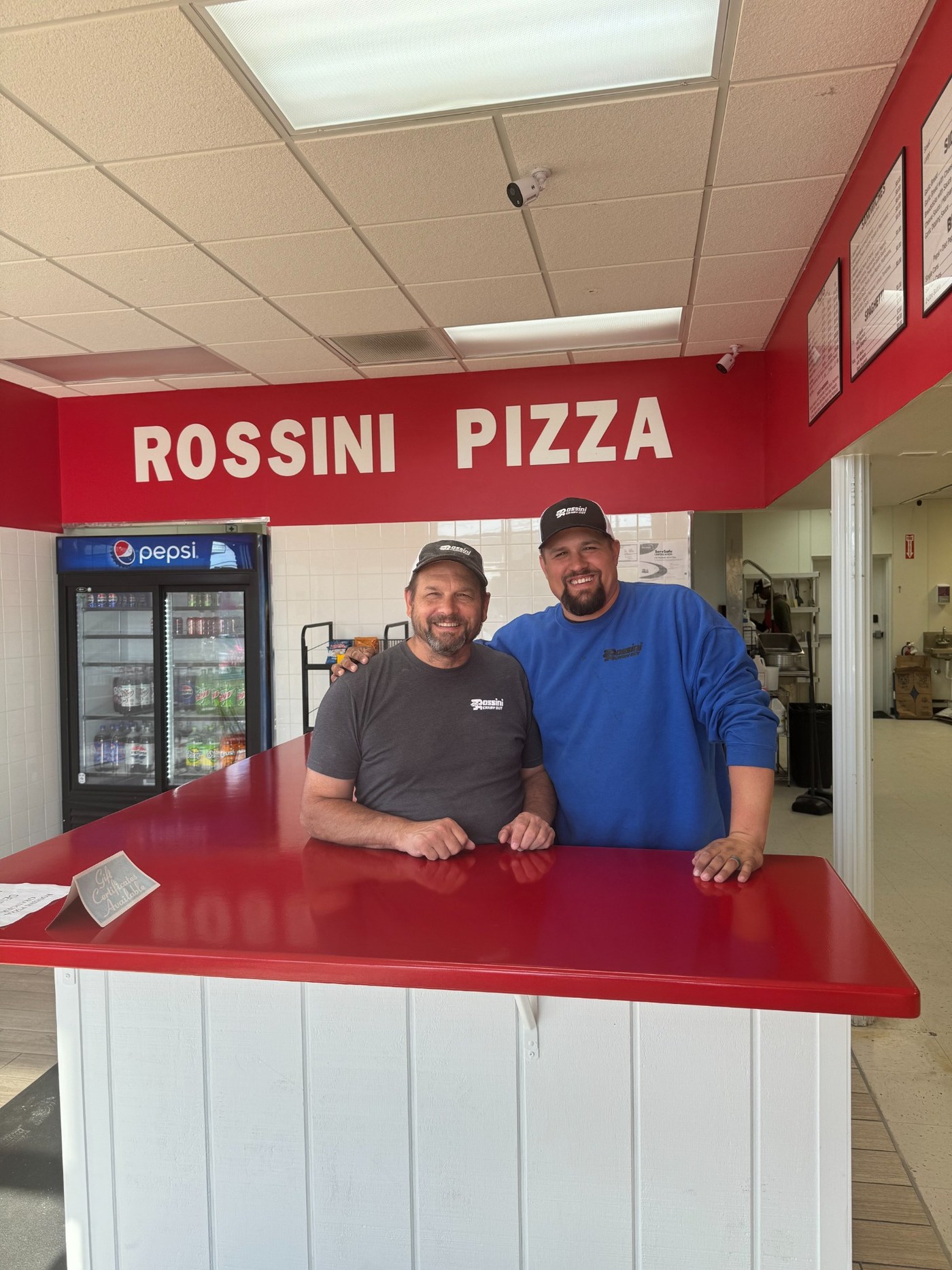 Rossini owner and son behind the counter